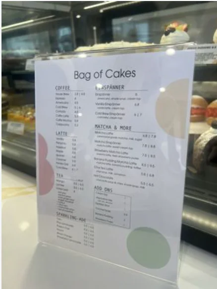 Bag of Cakes menu USA prices 2026 featuring cakes, pastries, cream puffs and specialty drinks