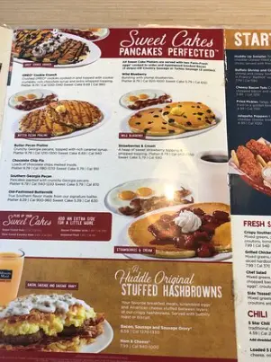 Huddle House menu featuring breakfast platters, golden waffles, burgers, and homestyle dinners