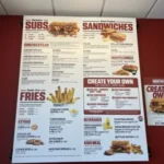 Penn Station menu with prices featuring grilled subs, cheesesteaks, cold sandwiches, fresh-cut fries, wraps, salads, and beverages in the USA.