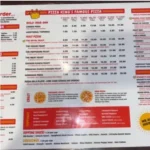 Pizza King menu with specialty pizzas, wings, sides, and drinks